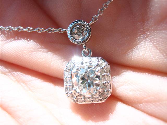 LTP's .46 ct. OEC pendant with bezel set .20 ct. OMC