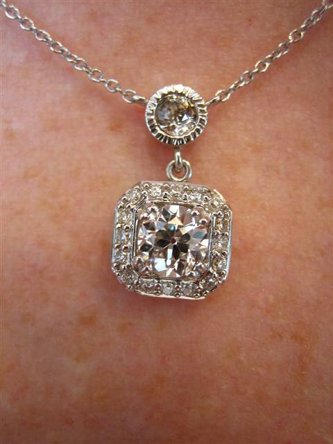 LTP's .46 ct. OEC pendant with bezel set .20 ct. OMC