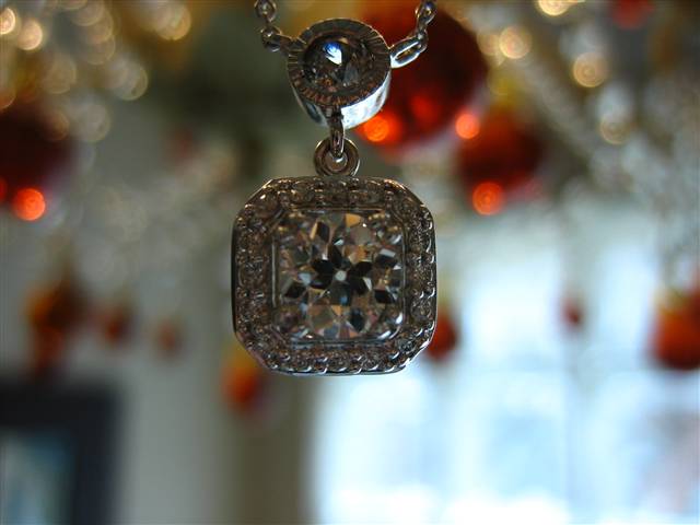 LTP's .46 ct. OEC pendant with bezel set .20 ct. OMC
