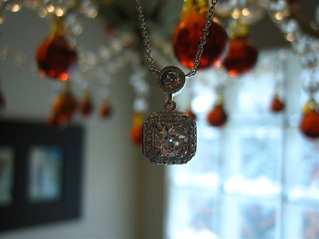 LTP's .46 ct. OEC pendant with bezel set .20 ct. OMC