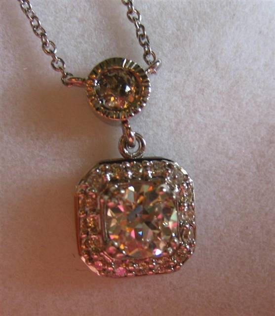 LTP's .46 ct. OEC pendant with bezel set .20 ct. OMC