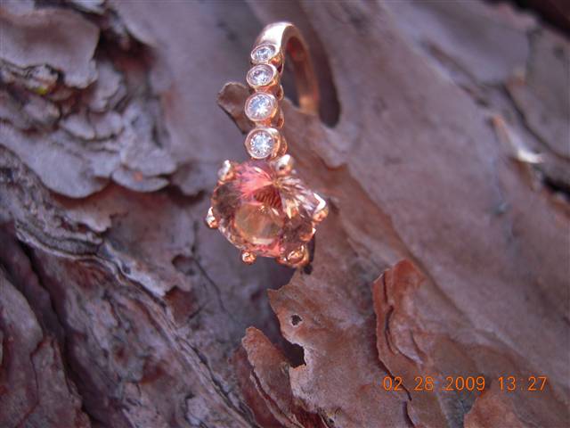 Peach toumaline in rose gold setting