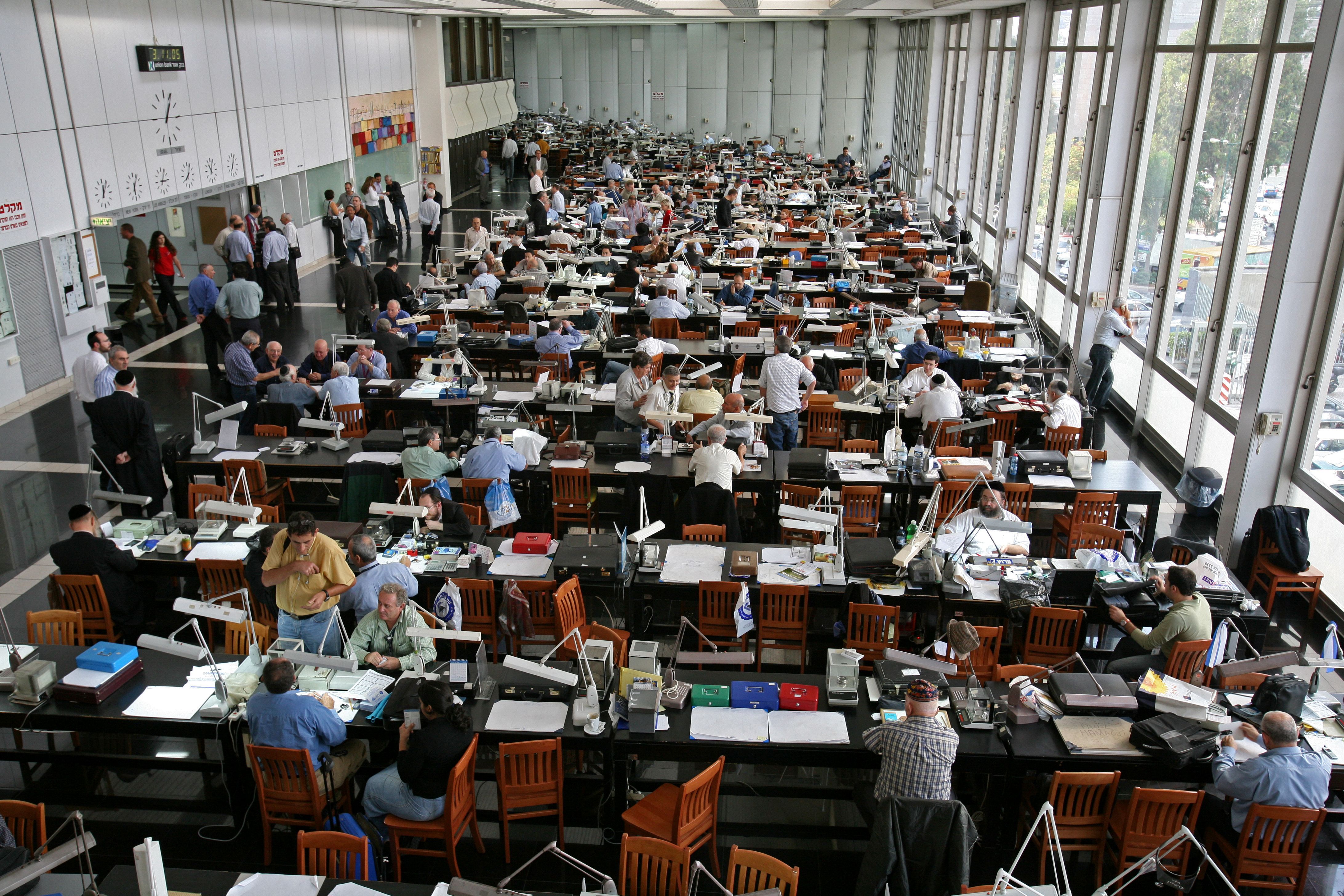 Fig 3. 3. Trading floor of the Israel Diamond Exchange, with its ceiling to floor north facing windows. - courtesy Israel Diamond Exchange