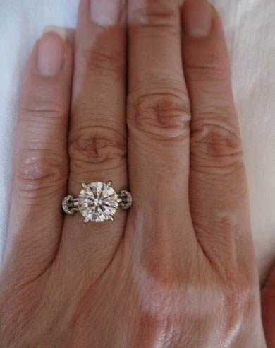 Solitaire diamond ring on the hand