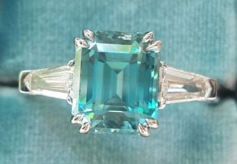 mochiko42’s 3 Stone Emerald Cut Blue Zircon Ring (Top View) - image from mochiko42