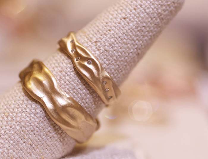 Textural gold wedding bands designed by Rebecca Overmann • Image Erika Winters
