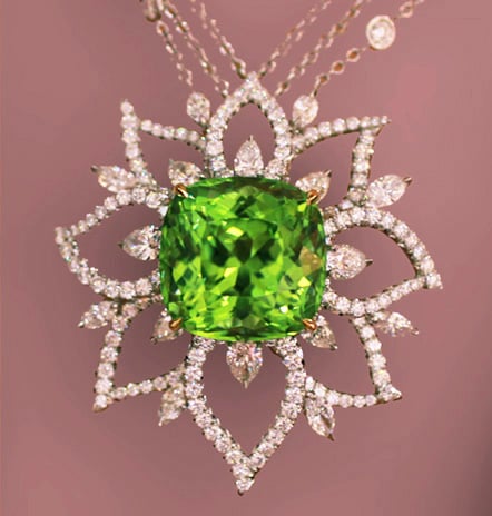 Richard Krementz platinum and 18K yellow prong-set pendant featuring a 33.58 ct. Peridot and Diamonds