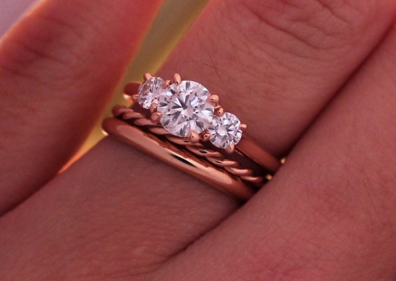 Rose gold 3-stone diamond ring with wedding bands