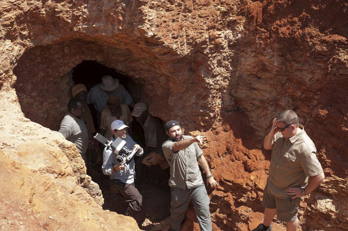 Miners, cast, and crew emerge from a mine. Image courtesy of Sharing the Rough.