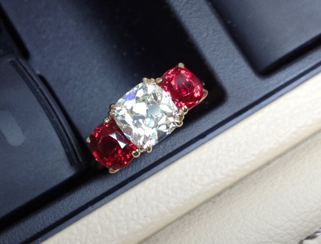 August Vintage Cushion diamond and red spinel 3-stone ring