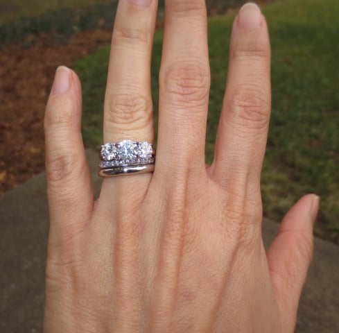 Three-stone diamond ring with wedding bands