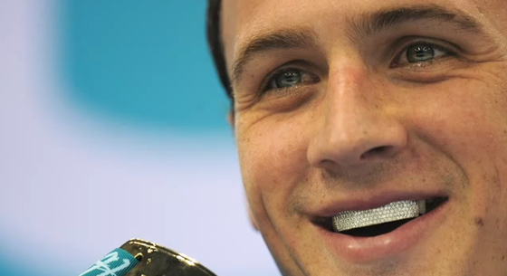 Olympic Gold Medalist Ryan Lochte wears his diamond grill