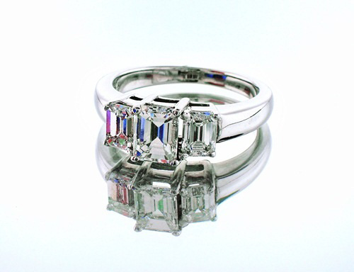 Union Diamond: Three-stone engagement ring with emerald-cut diamonds