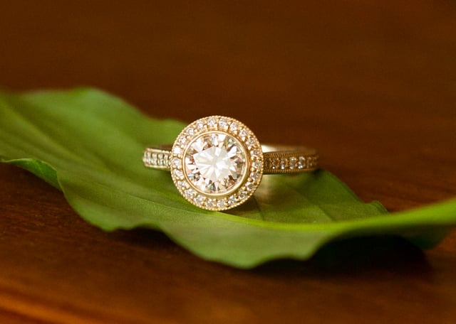 Yellow gold diamond halo engagement ring