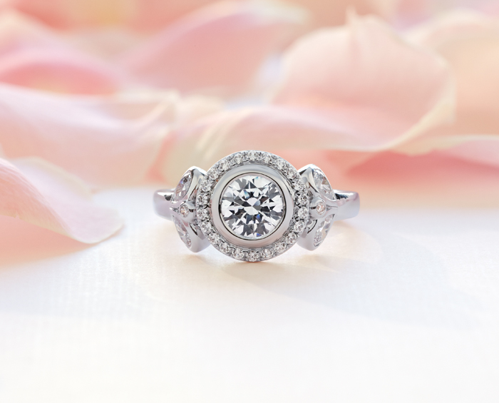 Truly Zac Posen bezel-set pavé halo engagement ring at Blue Nile