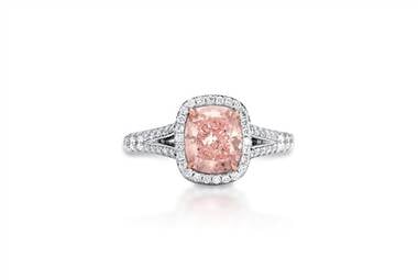 Cushion cut pink halo diamond ring set in platinum