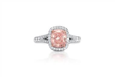 Cushion cut pink halo diamond ring set in platinum