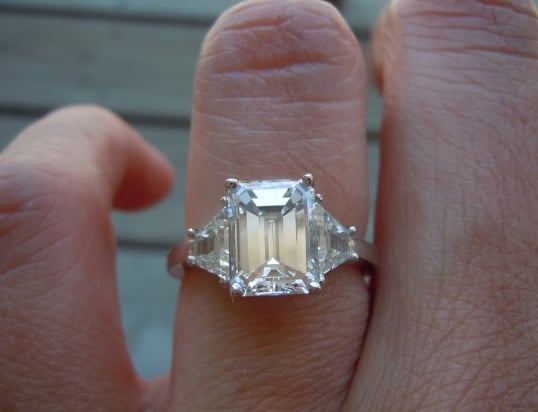 2-carat emerald-cut diamond ring with trapezoid-shaped side stones