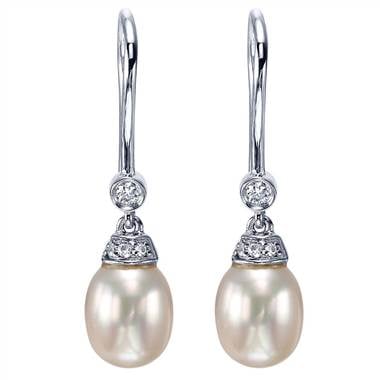 Pearl and diamond drop earrings set in 14K white gold at I.D. Jewelry 