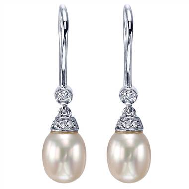 Pearl and diamond drop earrings set in 14K white gold at I.D. Jewelry 