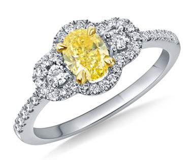 Fancy Intense Yellow Oval Cut Diamond Halo Ring Crafted in 18K Two Tone Gold(1 1/10 cttw.)