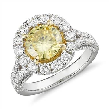 Fancy intense yellow diamond halo ring set in 18K white and yellow gold at Blue Nile 