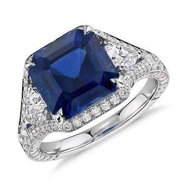 Emerald-cut sapphire and diamond halo ring set in 18K white gold at Blue Nile  