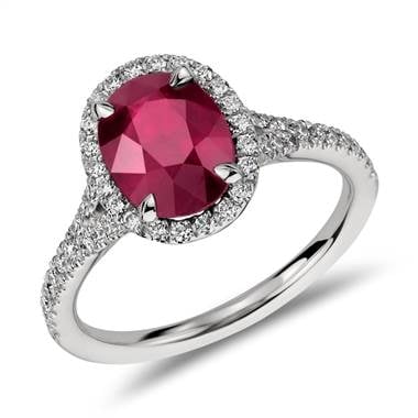 Oval ruby and diamond halo ring set in platinum at Blue Nile  