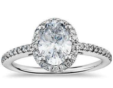 Oval diamond halo engagement ring set in 14K white gold at Blue Nile 