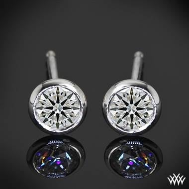 Handmade full bezel” diamond earrings setting in platinum at Whiteflash