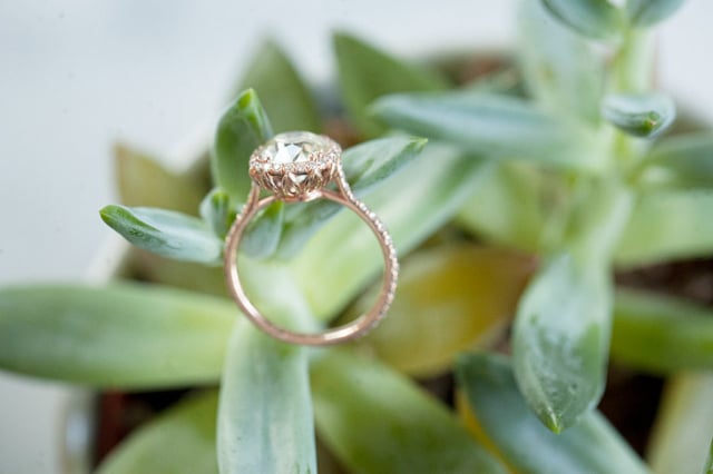 Custom diamond halo engagement ring in rose gold