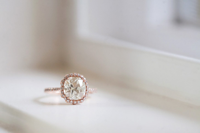 Custom diamond halo engagement ring in rose gold