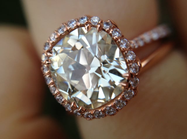 Custom diamond halo engagement ring in rose gold