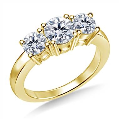 Top: Three stone round diamond engagement ring set in 18K yellow gold at B2C Jewels  