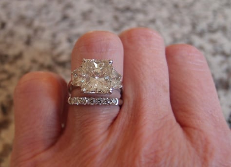 5 carat radiant cut diamond ring on the hand