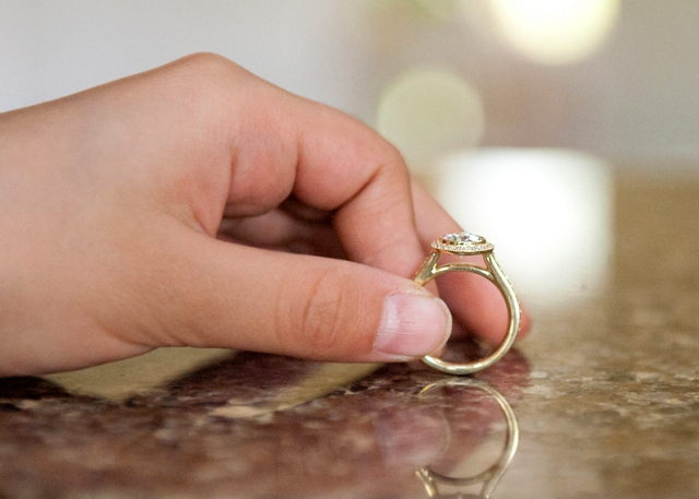 Yellow gold diamond halo engagement ring