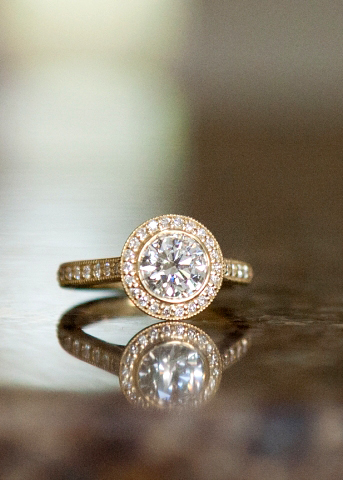 Yellow gold diamond halo engagement ring