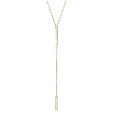 A delicate lariat necklace will highlight your stunning collarbones. Double bar lariat-Y necklace set in 14K yellow gold at Blue Nile 