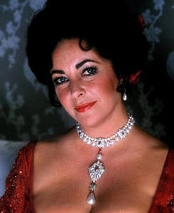 Elizabeth Taylor wearing Cartier Ruby Necklace with La Peregrina Pearl