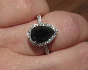 Black diamond halo ring.