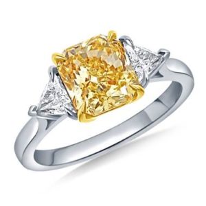 Fancy intense yellow radiant three stone ring with trillion set in platinum and 18K yellow gold at B2C Jewels 