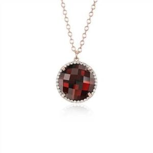 Garnet and diamond halo pendant set in 14K rose gold at Blue Nile 