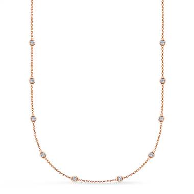 Show you’re anything but a damsel in distress by wearing this bezel set diamond station necklace set in 14K rose gold at B2C Jewels