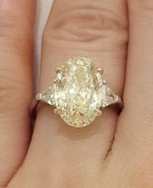 HNGN originally posted this incredible yellow diamond oval engagement ring on the Show Me the Bling forum at PriceScope. What a stunning piece this is, the two-tone, three stone beauty is a feast for the eyes! I think I need a lemon drop!