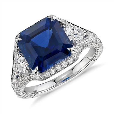 Emerald-cut sapphire and diamond halo ring set in 18K white gold at Blue Nile