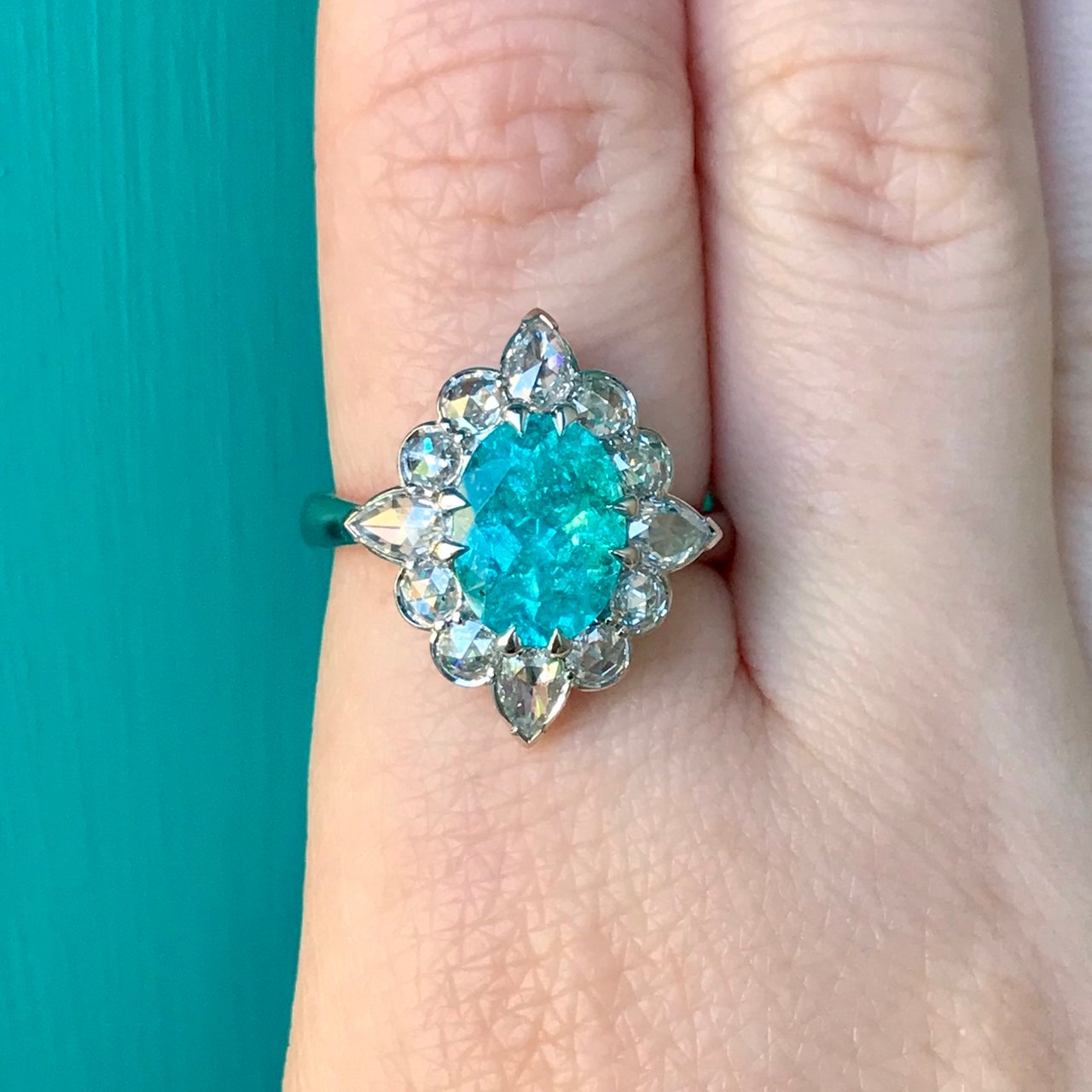 Distracts posted this phenomenally beautiful Paraiba in rose cut halo ring on the Show Me the Bling forum at PriceScope.  I can’t stop looking at it, it’s so pretty! I am head over heals for the color and shapes in this stunner. TDF!