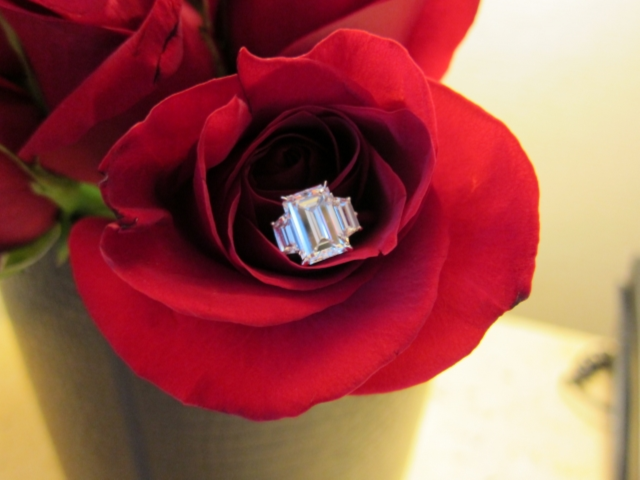 PM1742  originally posted this beautiful emerald cut engagement ring on the Show Me the Bling forum at PriceScope. Fabulous! This emerald cut with side step-cut trapezoids is out of this world!