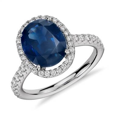Oval sapphire and diamond halo micropave ring set in 18K white gold at Blue Nile