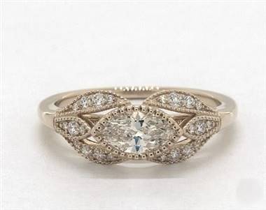 A floral marquise-shape milgrain engagement ring set in 14K yellow gold at James Allen.