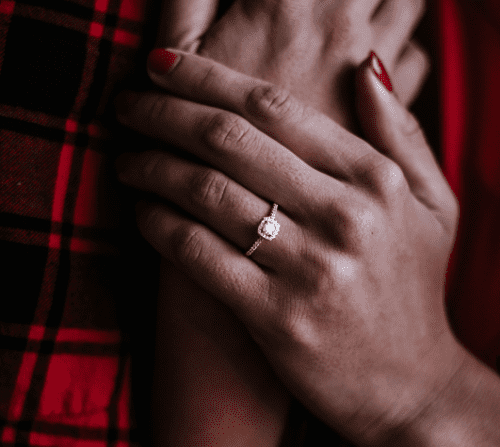 Solitaire engagement ring with french pavé setting. Image Source: Zelle Duda on Unsplash.